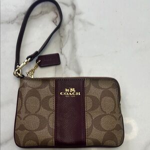 - Coach Brown Signature Wristlet with Gold Accents